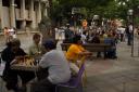 People enjoying the evening on the 16th Street Mall